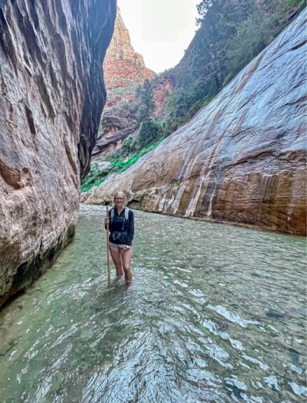 Myself standing in the water in a narrow Zion Canyon.