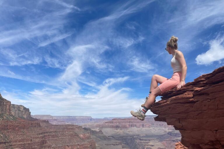 Myself sitting on a rock in Arizona while hiking in hot weather.