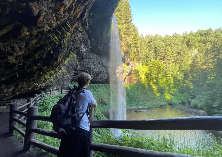 Tyler looking out into a waterfall after doing a 3 mile hike.