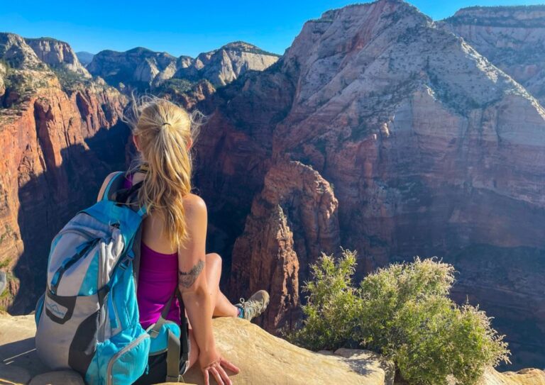 Myself sitting on a rock after hiking alone in Zion National Park.