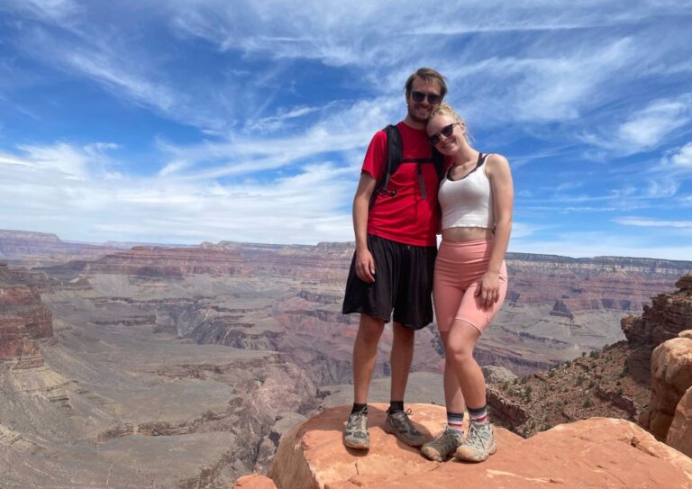 Tyler and I in the Grand Canyon on an overlook wearing clothes that help us stay cool while hiking.