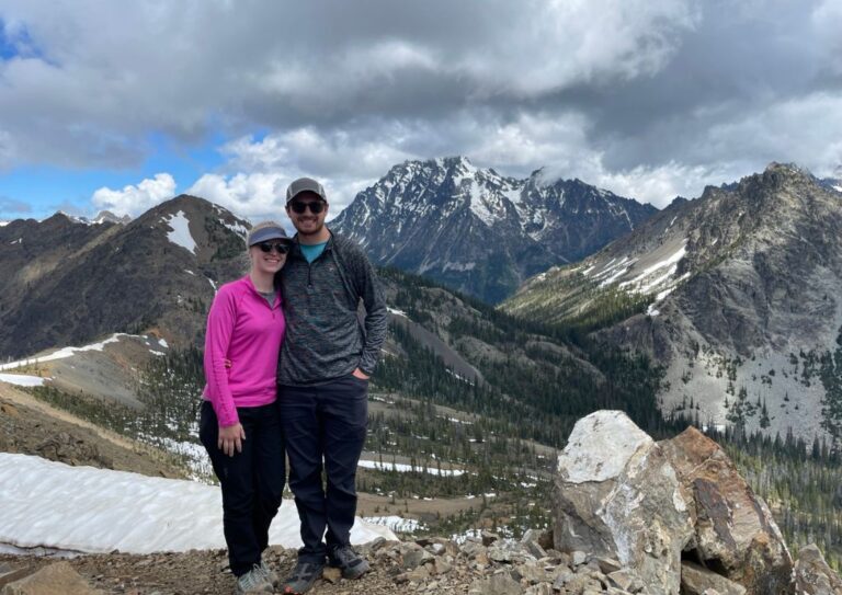 Tyler and I standing near an overlook, both wearing hiking pants instead of shorts.