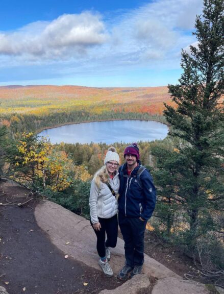 Myself and Tyler standing near an overlook in Minnesota with fall colors covering the trees.